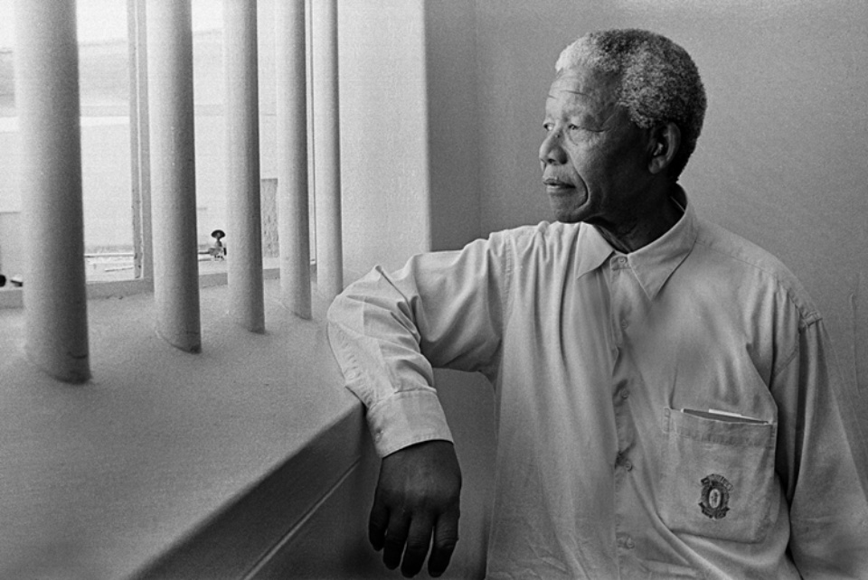 Jürgen Schadeberg Nelson Mandela in his cell (Revisit) Robben Island, 1994 Signed, titled and dated Gelatin silver print, printed later