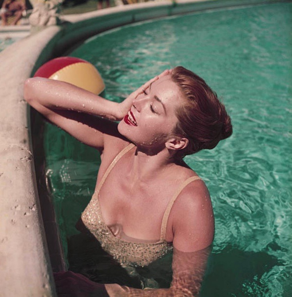 Slim Aarons. Esther Williams, Relaxing in a pool, Florida, 1955